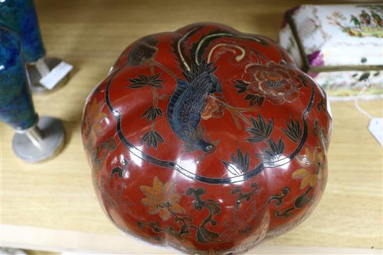 A Chinese lacquer pumpkin shaped box and cover